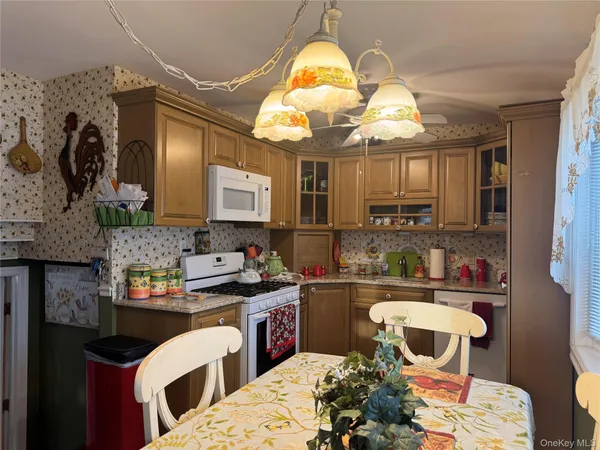 a kitchen with a table and chairs in it