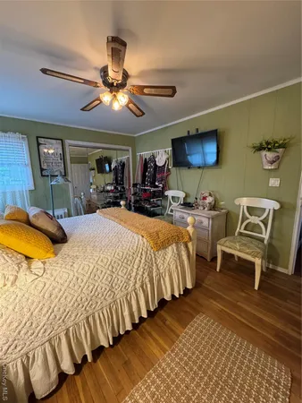a bed room with a bed and a chandelier