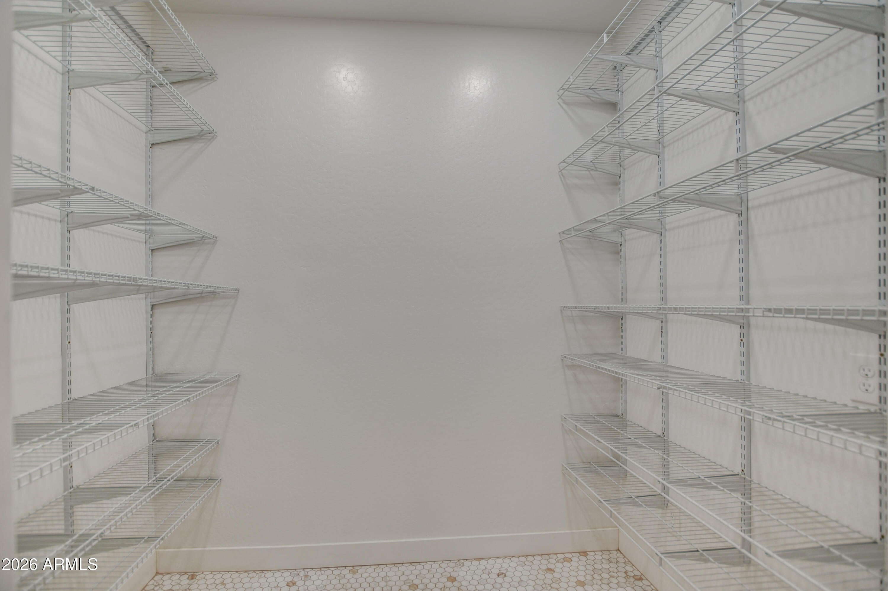 3078 East Muirfield Street Gilbert, AZ 85298 - Photo 46 of 92 a view of a room with racks on the wall