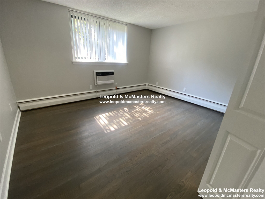 519 Washington Street, Unit 2 Brookline, MA 02446 - Photo 6 of 11 a view of empty room with window