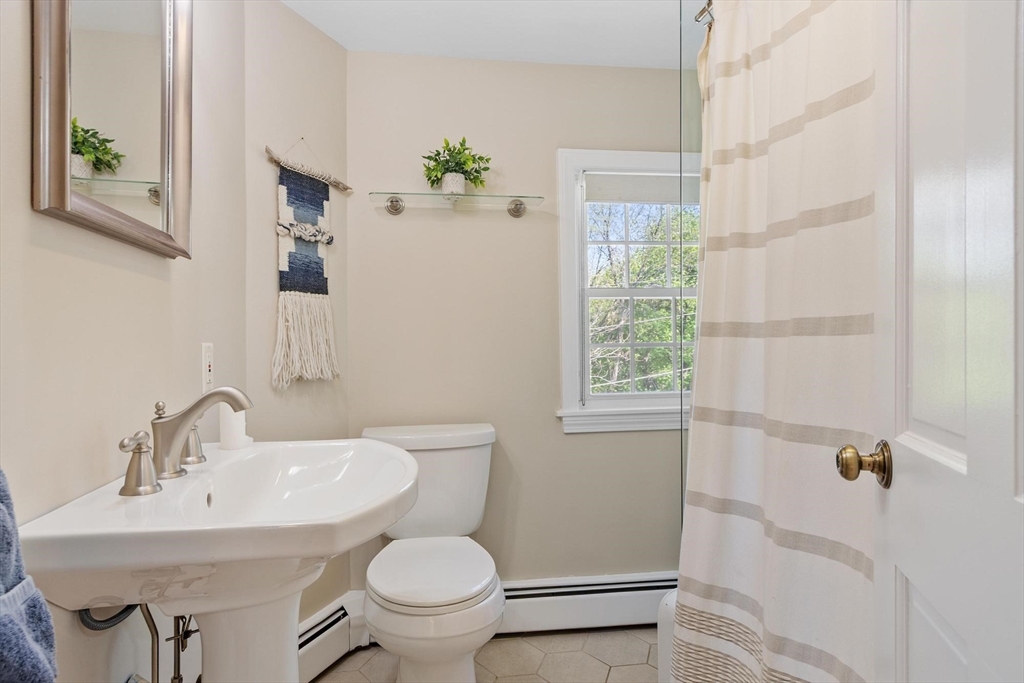 25 Naples Road Melrose, MA 02176 - Photo 19 of 36 a bathroom with a sink toilet and a mirror