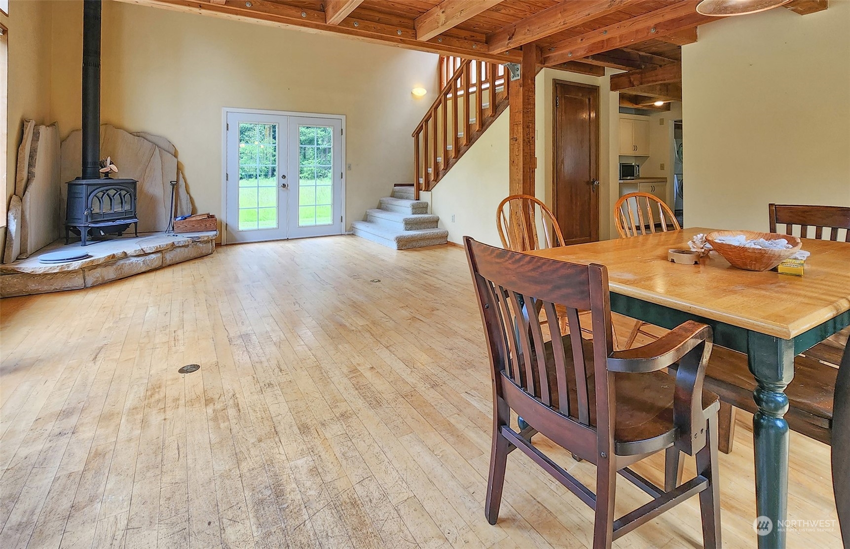 482 Old Homestead Road Lopez Island, WA 98261 - Photo 8 of 27 a view of a dining room with furniture and a window