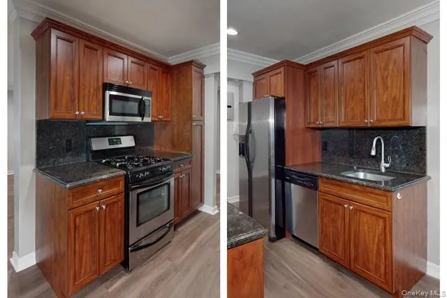 a kitchen with stainless steel appliances granite countertop a stove a sink dishwasher a refrigerator and a microwave oven with wooden floor