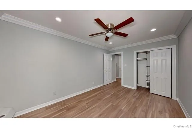 a view of an empty room and wooden floor