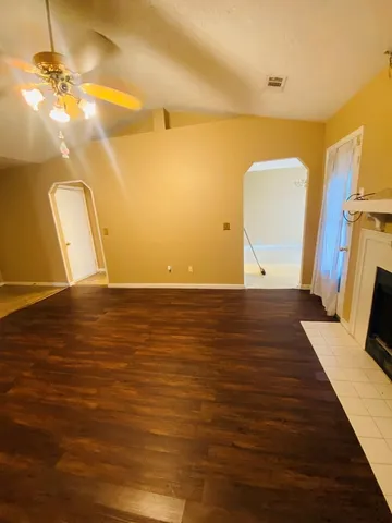 a view of room with wooden floor