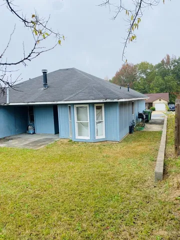 a house view with a swimming pool