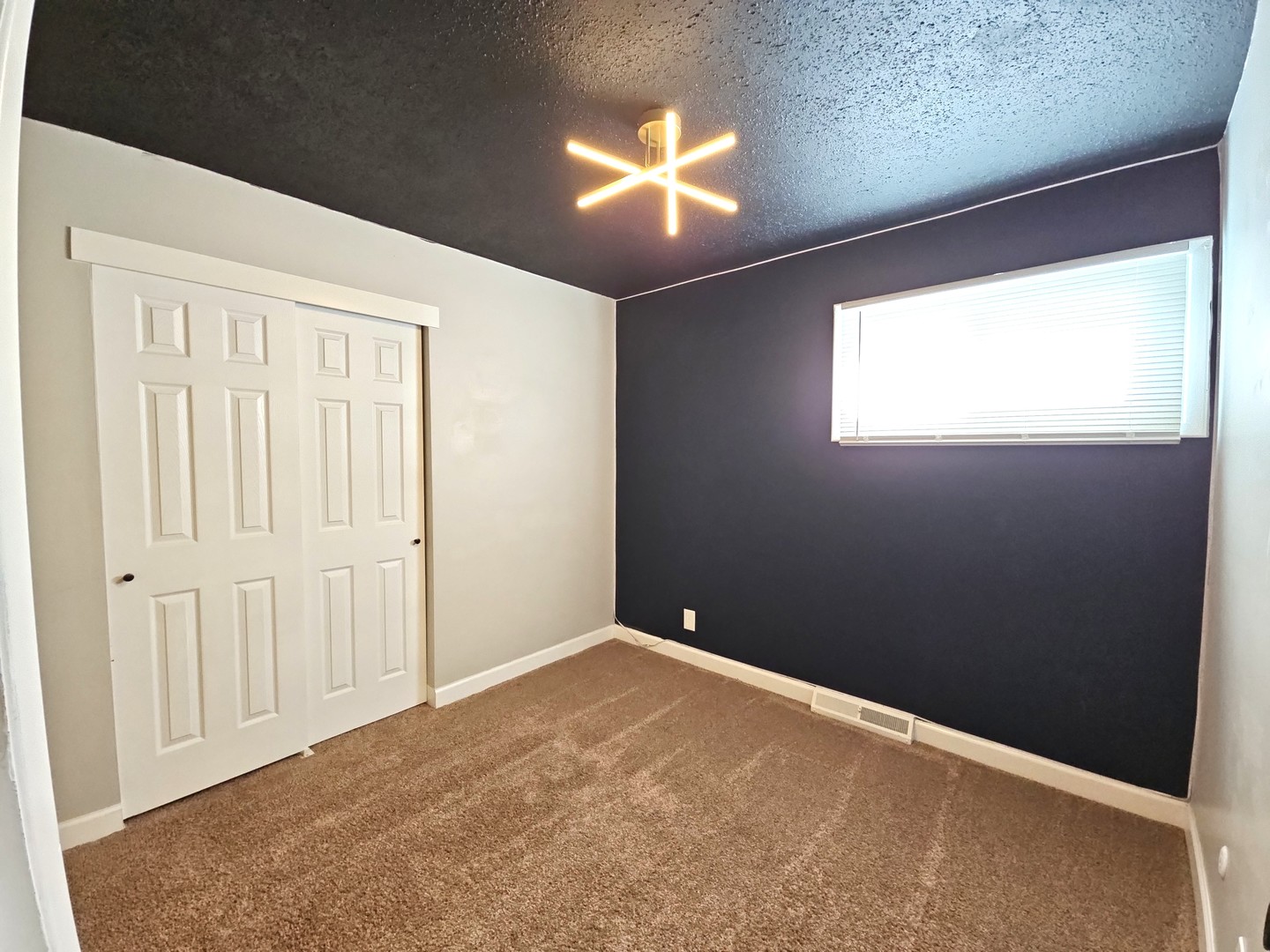1322 Calvin Street Davenport, IA 52804 - Photo 11 of 25 a view of an empty room and a window