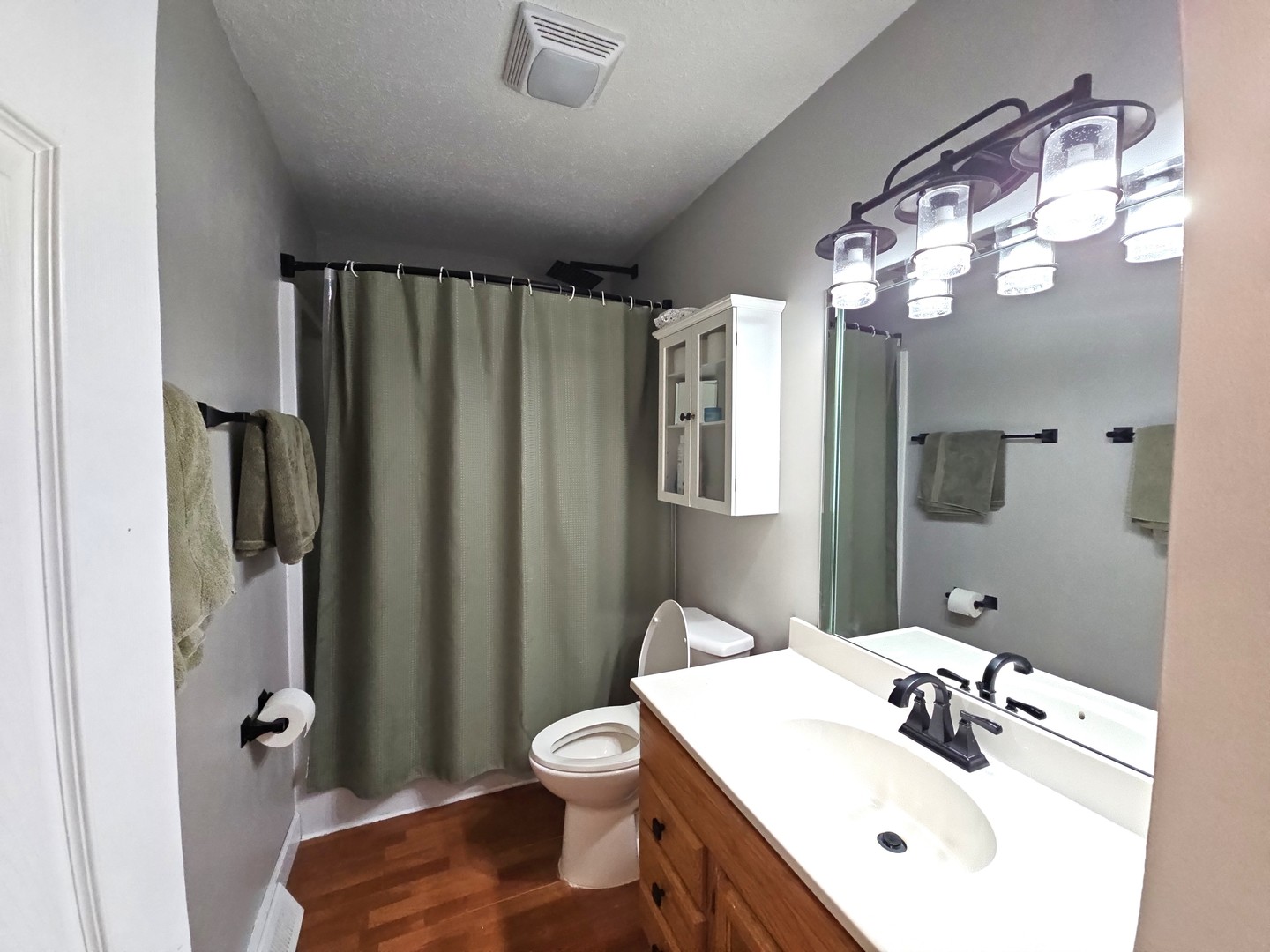 1322 Calvin Street Davenport, IA 52804 - Photo 12 of 25 a bathroom with a sink a mirror and a toilet