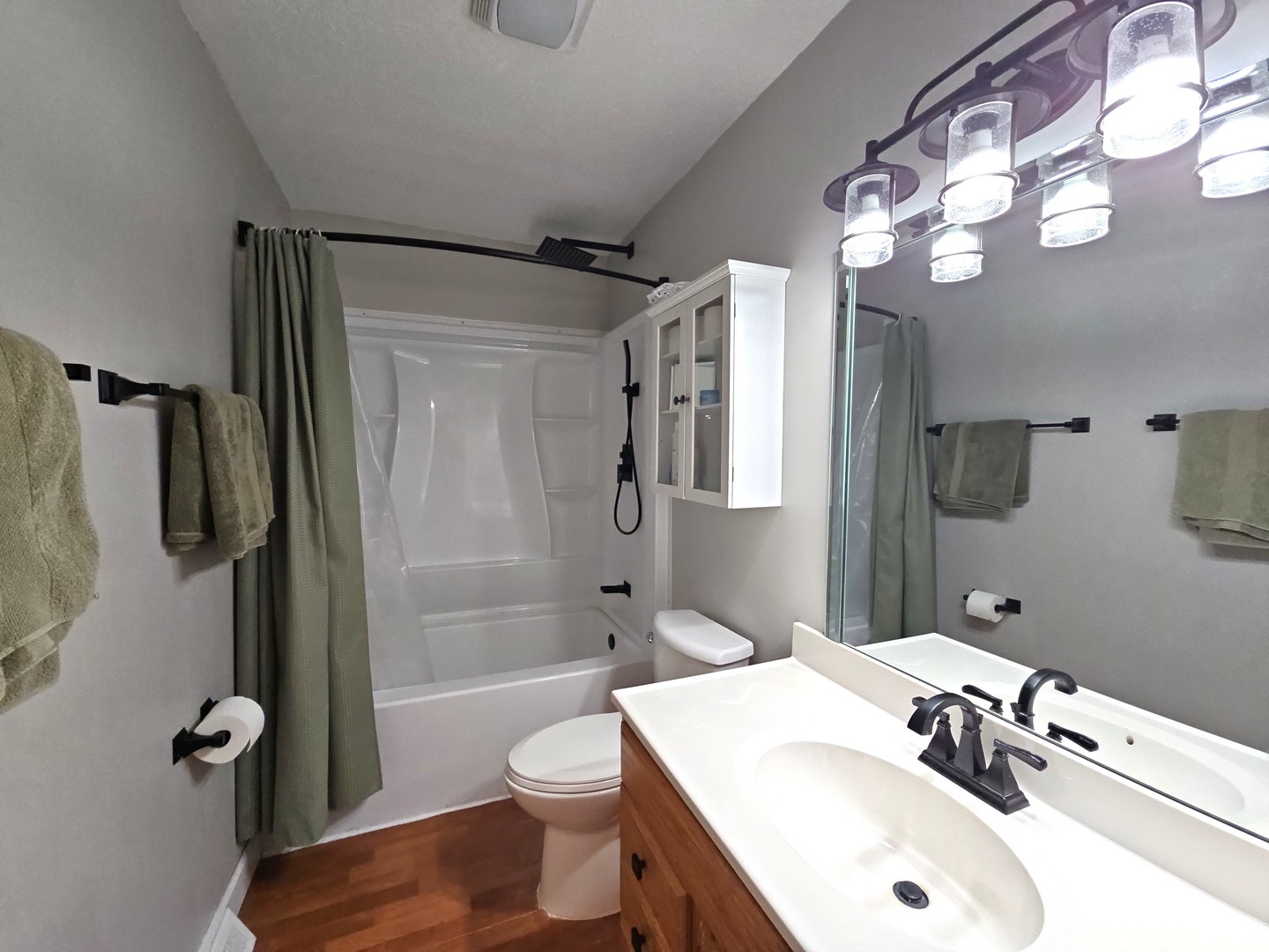 1322 Calvin Street Davenport, IA 52804 - Photo 13 of 25 a bathroom with a sink a toilet a mirror and shower