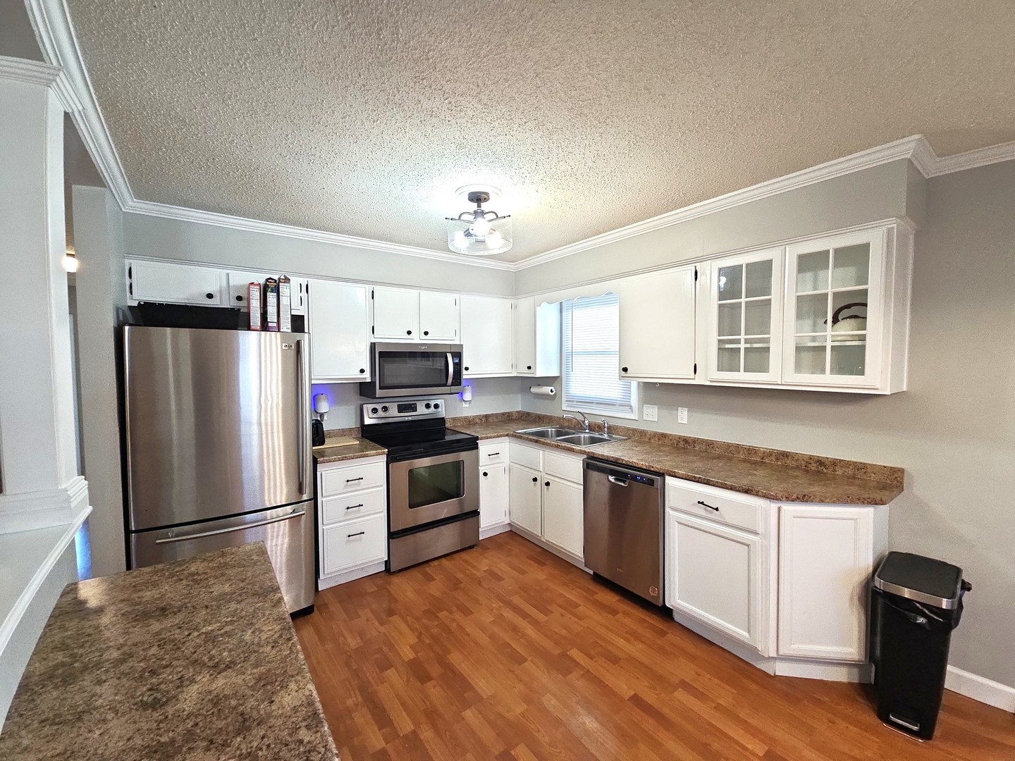 1322 Calvin Street Davenport, IA 52804 - Photo 4 of 25 a kitchen with granite countertop a refrigerator stove top oven and sink