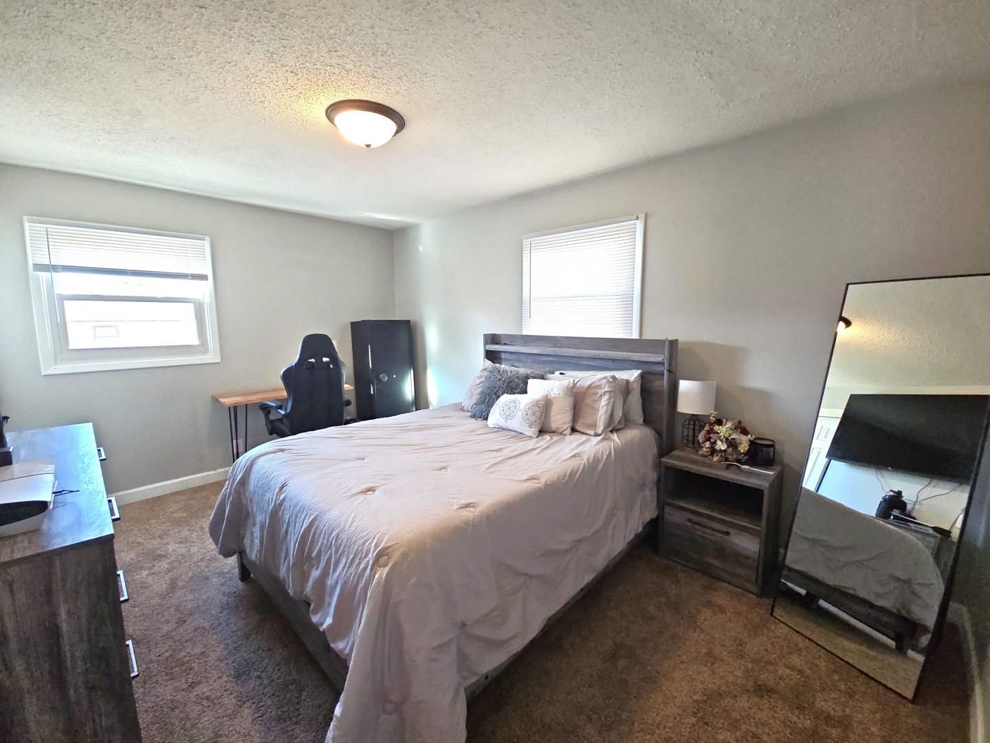 1322 Calvin Street Davenport, IA 52804 - Photo 8 of 25 a bedroom with a bed and a tv