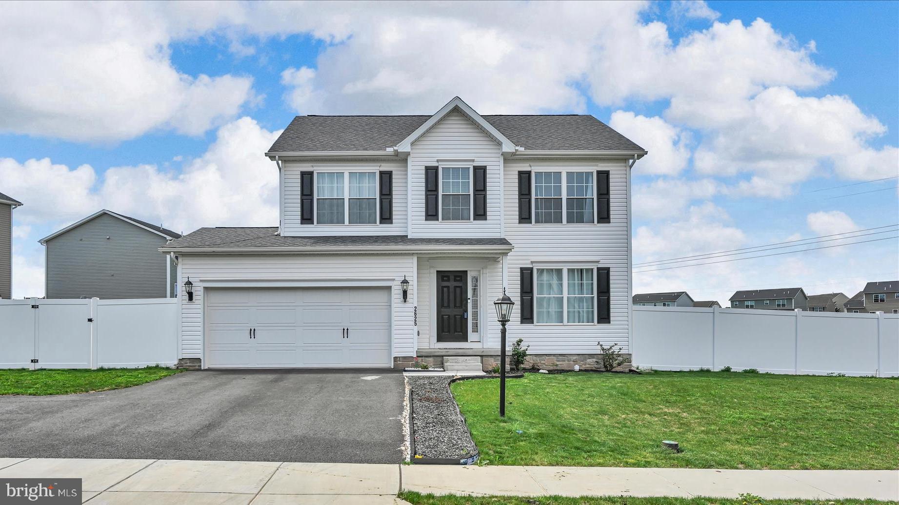 2625 Village Road Dover, PA 17315 - Photo 2 of 15 a view of a yard in front of a house