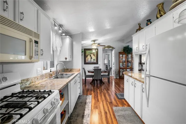 a bedroom with a bed and large window