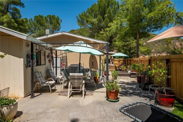 an outdoor space with furniture and umbrella