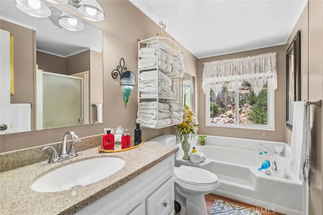 an aerial view of residential house and sandy dunes