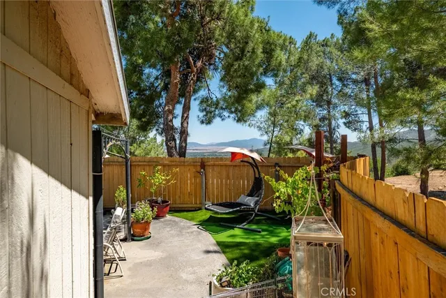 a view of a livingroom with furniture and a window