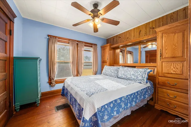 a view of an entryway with wooden floor and stairs