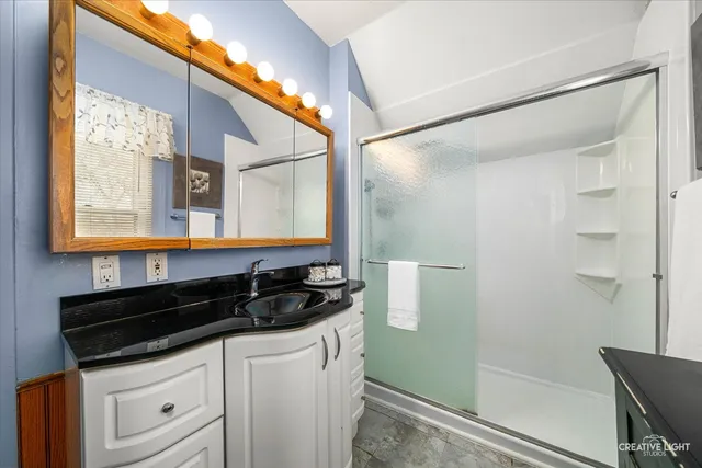 a balcony with table and chairs