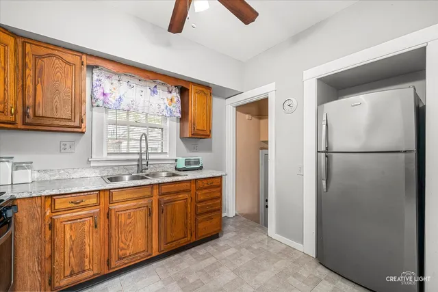a living room with furniture a fireplace and a window