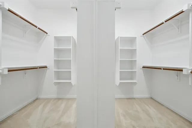 a view of an empty walk in closet