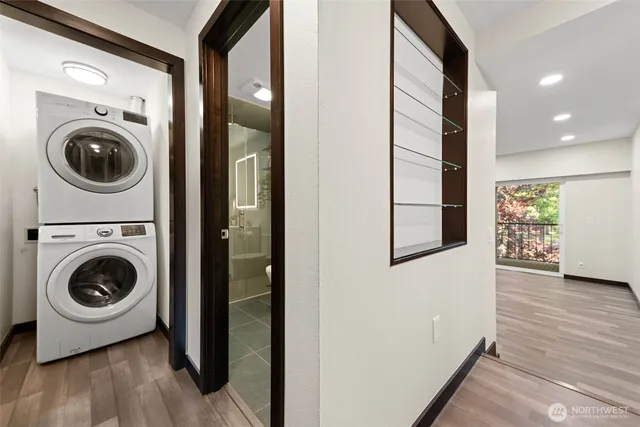 a view of a hallway with washer and dryer