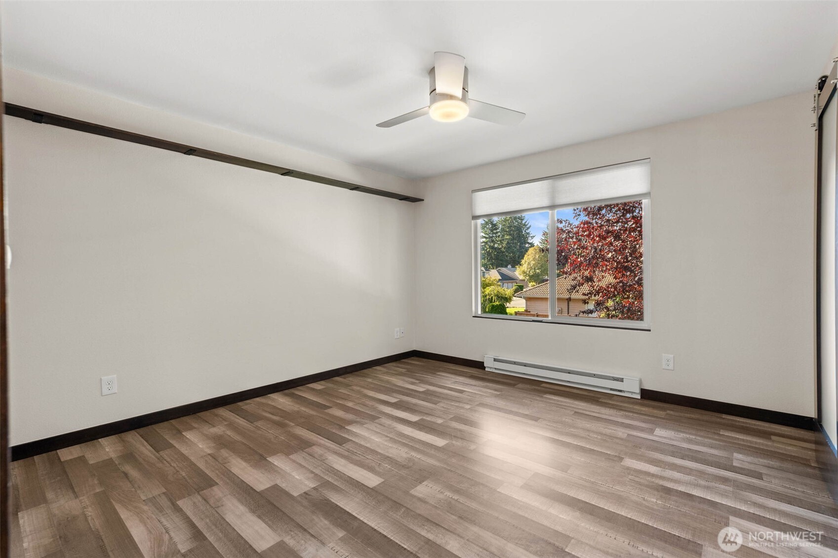 8641 Zircon Drive Southwest, Unit U3 Lakewood, WA 98498 - Photo 18 of 32 wooden floor in an empty room