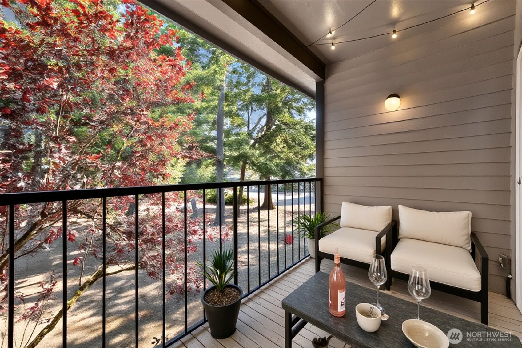 8641 Zircon Drive Southwest, Unit U3 Lakewood, WA 98498 - Photo 25 of 32 a balcony with furniture and a potted plant