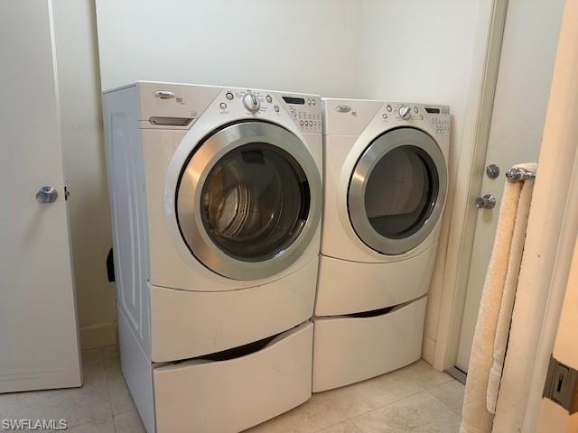 1261 Pine Ridge Road Naples, FL 34108 - Photo 13 of 13 a utility room with dryer and washer