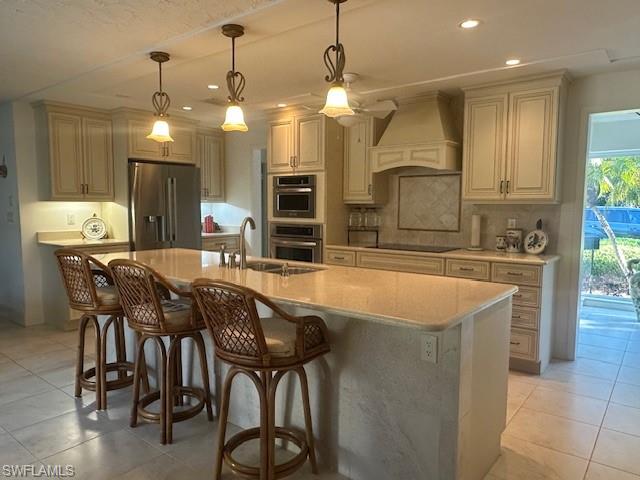 1261 Pine Ridge Road Naples, FL 34108 - Photo 5 of 13 a large kitchen with a table and chairs