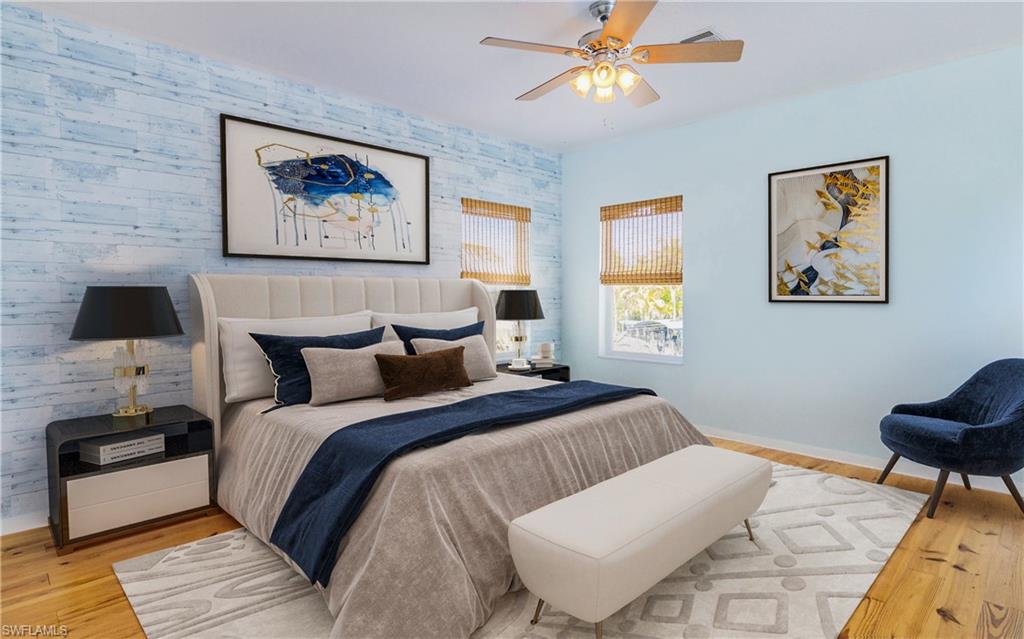 12277 Boat Shell Drive Matlacha Isles, FL 33991 - Photo 31 of 46 a bedroom with a bed and a lamp on dresser