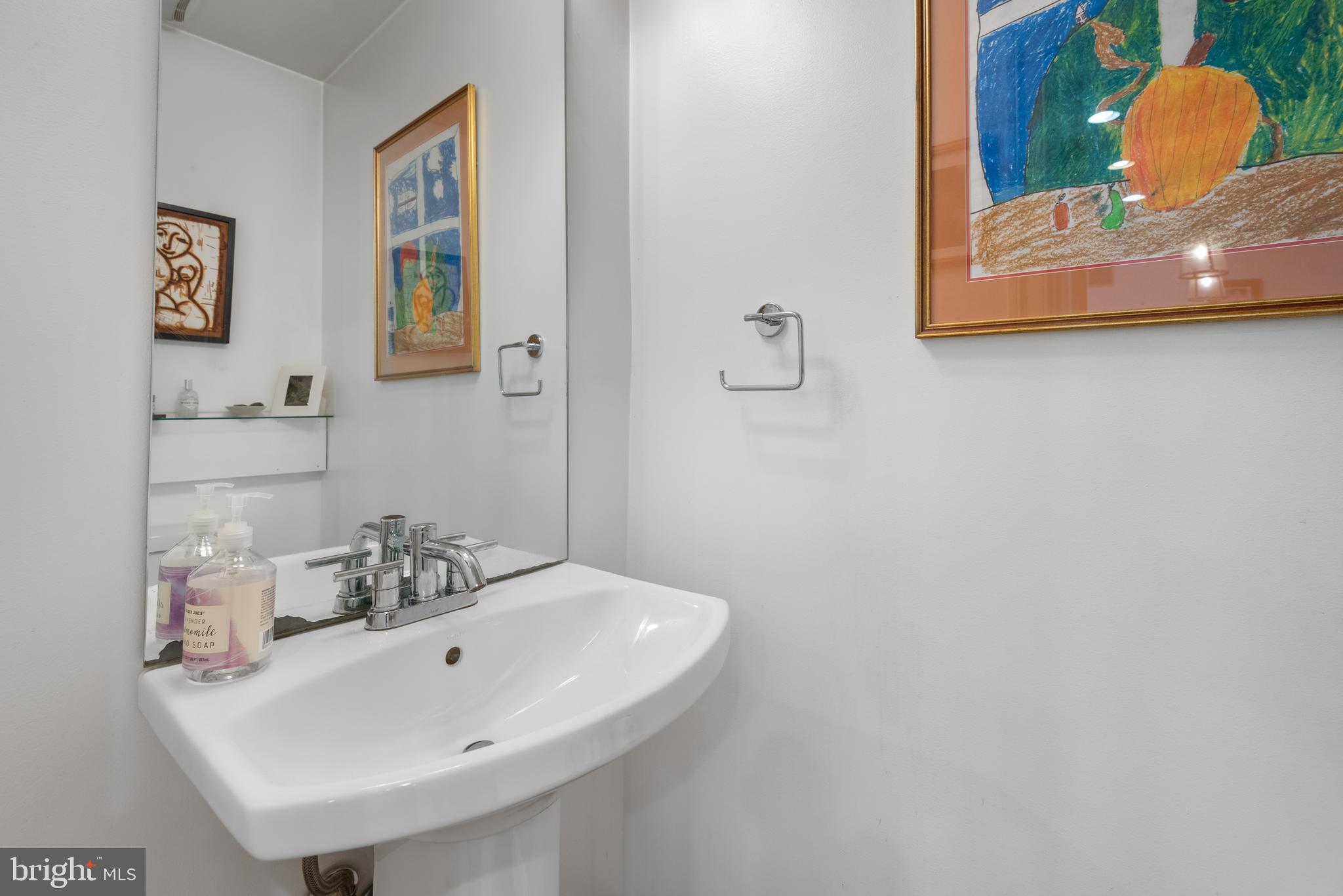 1428 Shepherd Street Northwest, Unit 1 Washington, DC 20011 - Photo 11 of 48 a bathroom with a sink and a mirror