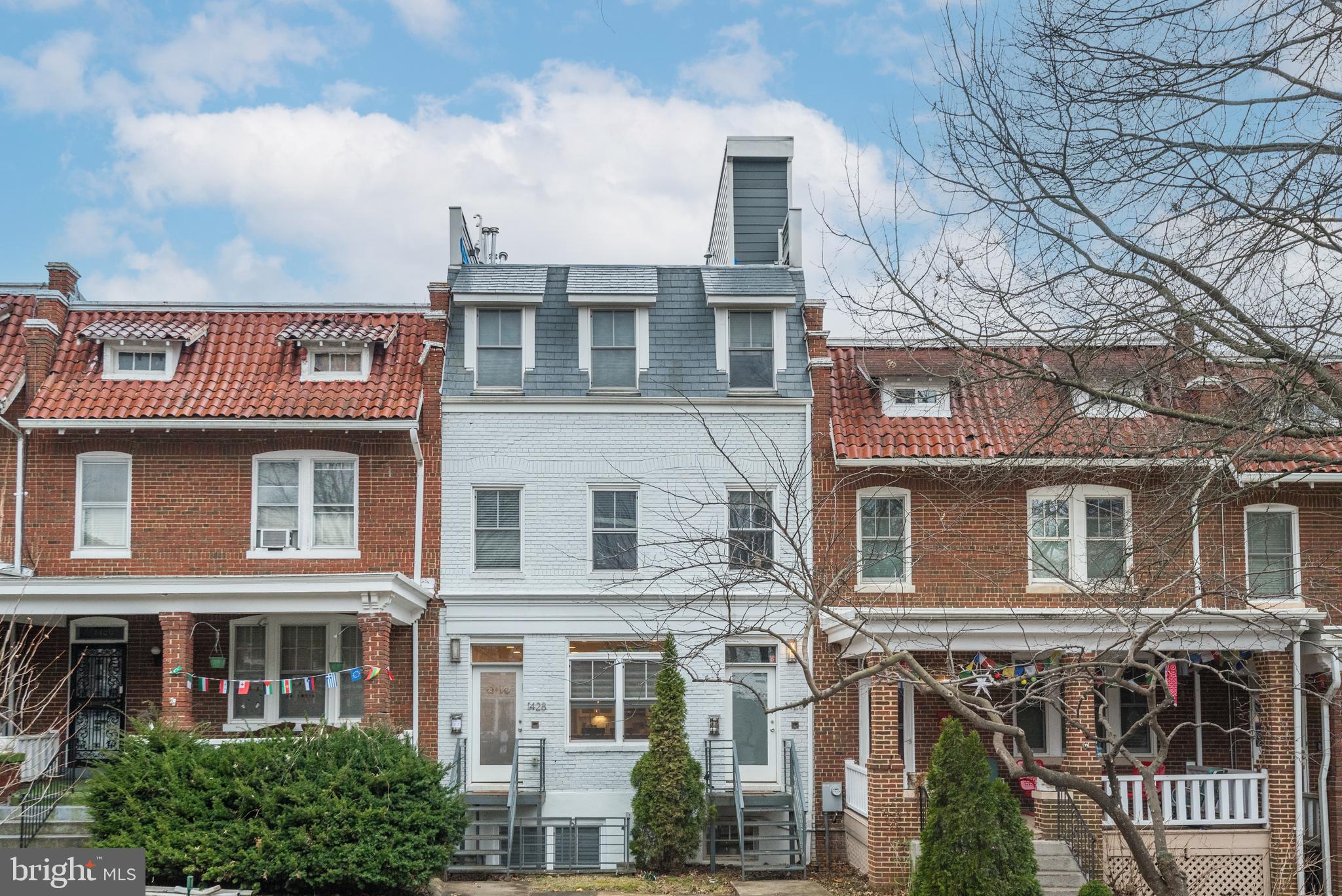 1428 Shepherd Street Northwest, Unit 1 Washington, DC 20011 - Photo 2 of 48 a view of a brick building next to a yard