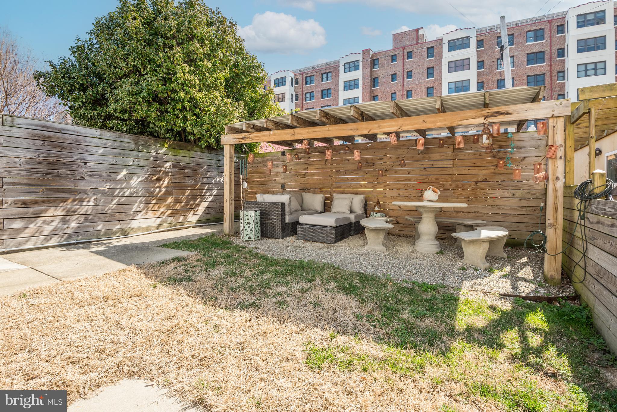 1428 Shepherd Street Northwest, Unit 1 Washington, DC 20011 - Photo 40 of 48 a view of a building with a yard