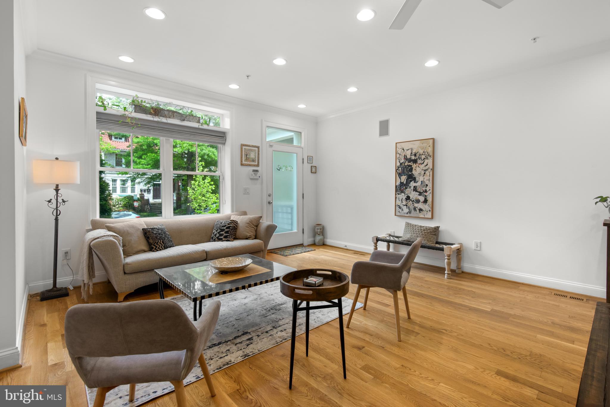 1428 Shepherd Street Northwest, Unit 1 Washington, DC 20011 - Photo 4 of 48 a living room with furniture and a large window