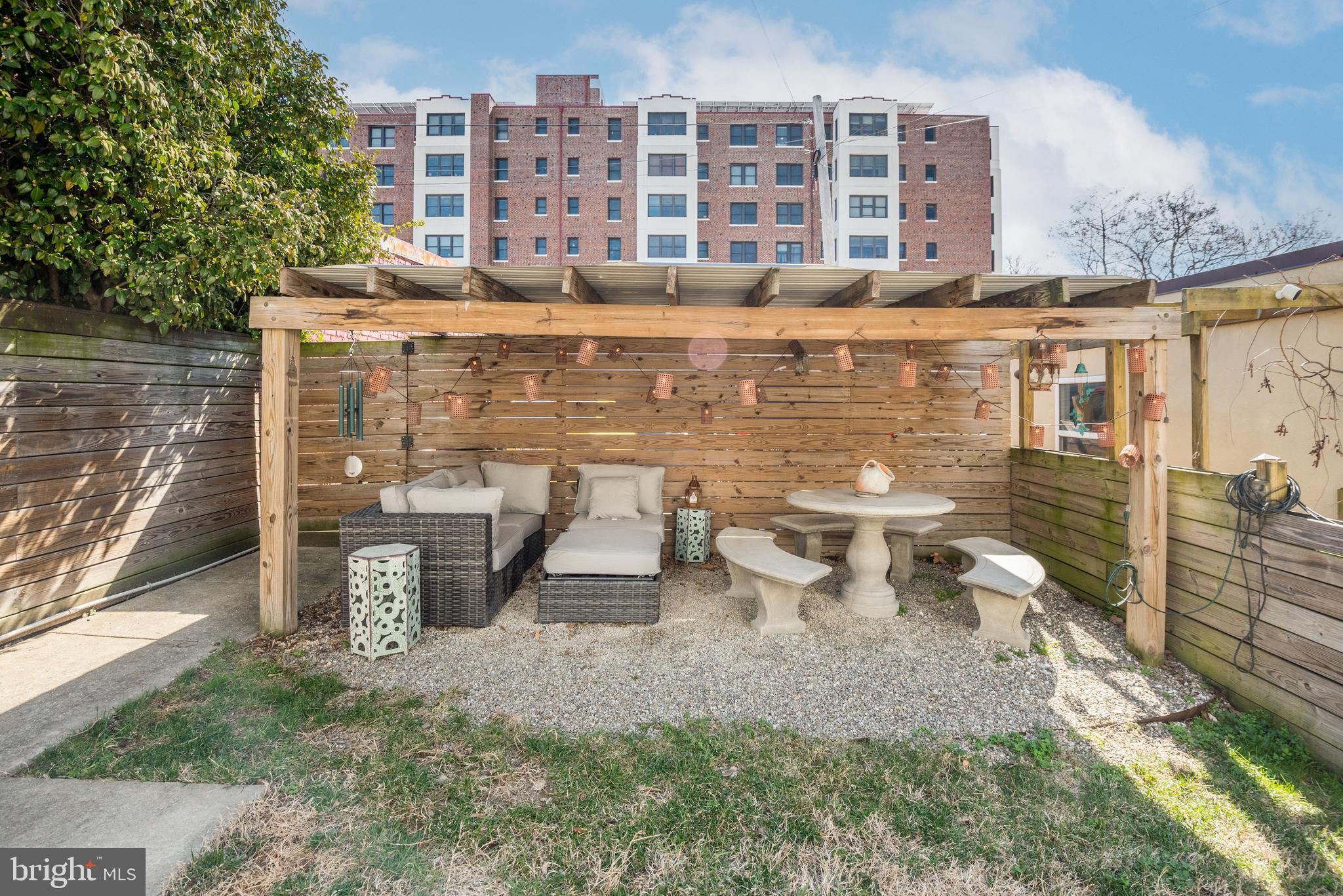 1428 Shepherd Street Northwest, Unit 1 Washington, DC 20011 - Photo 42 of 48 a view of a patio with table and chairs and potted plants