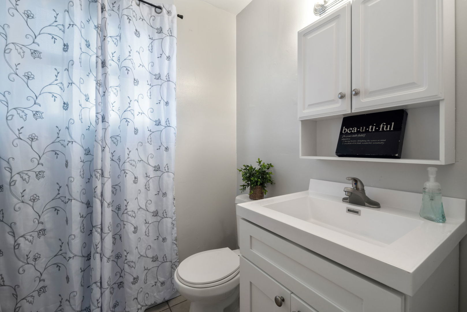 2102 West 73rd Street Chicago, IL 60636 - Photo 11 of 20 a bathroom with a sink toilet and vanity
