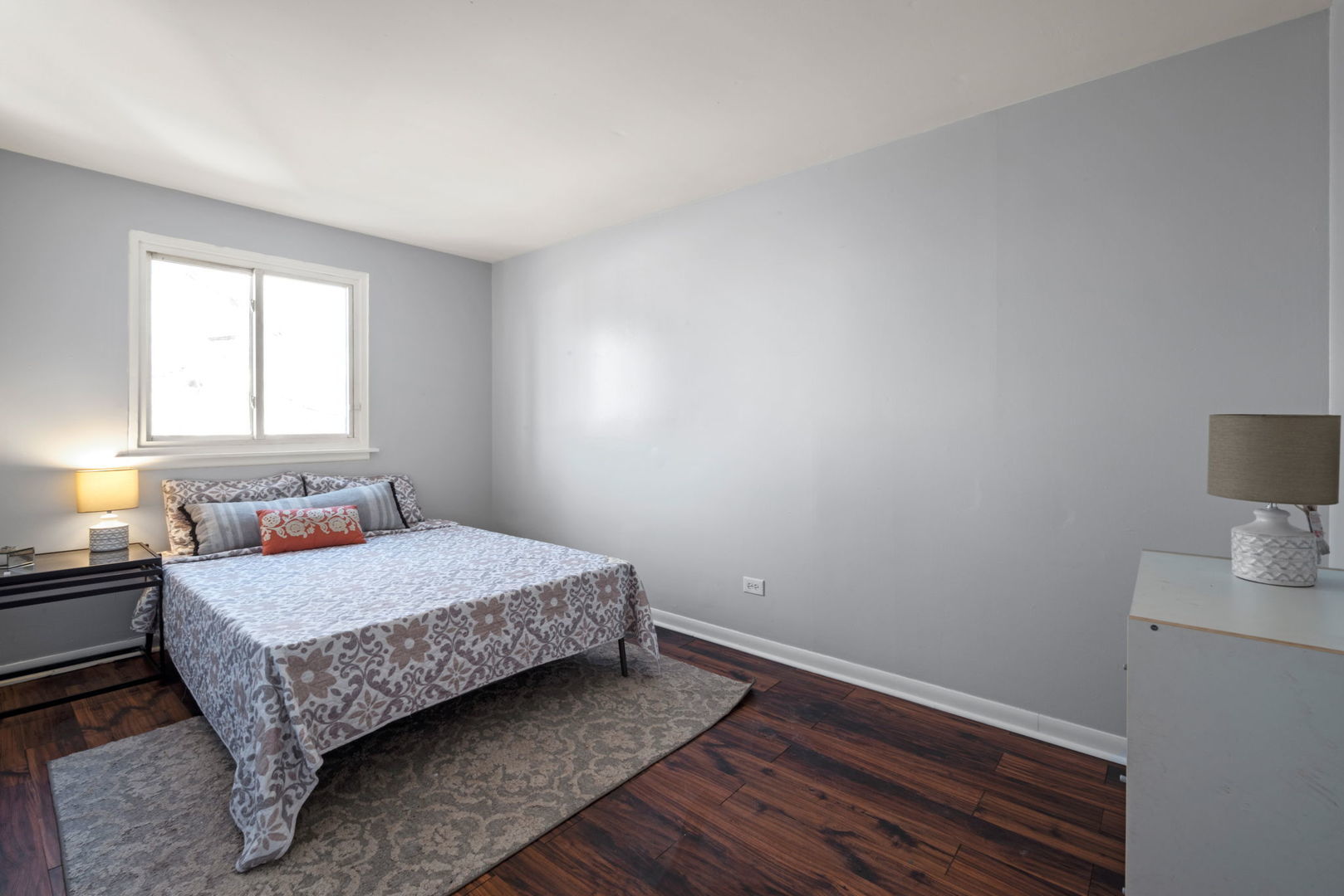 2102 West 73rd Street Chicago, IL 60636 - Photo 13 of 20 a bedroom with a bed and a lamp on the dresser
