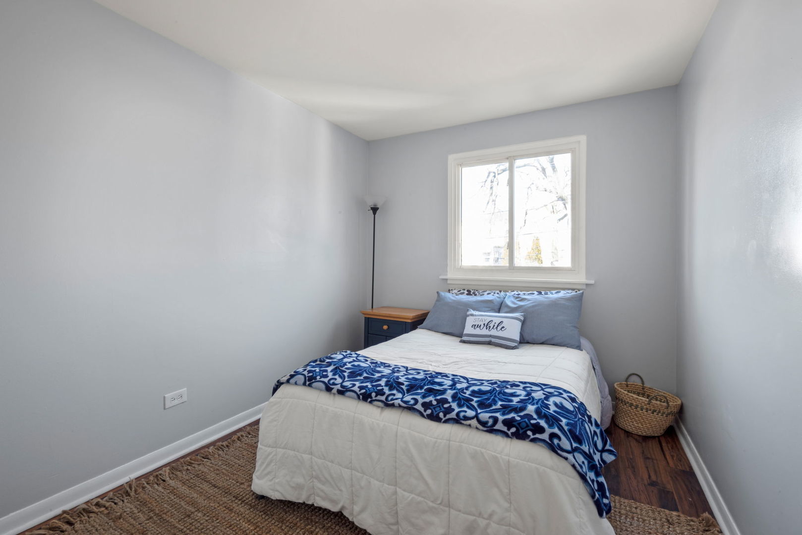 2102 West 73rd Street Chicago, IL 60636 - Photo 14 of 20 a bedroom with a bed and a window