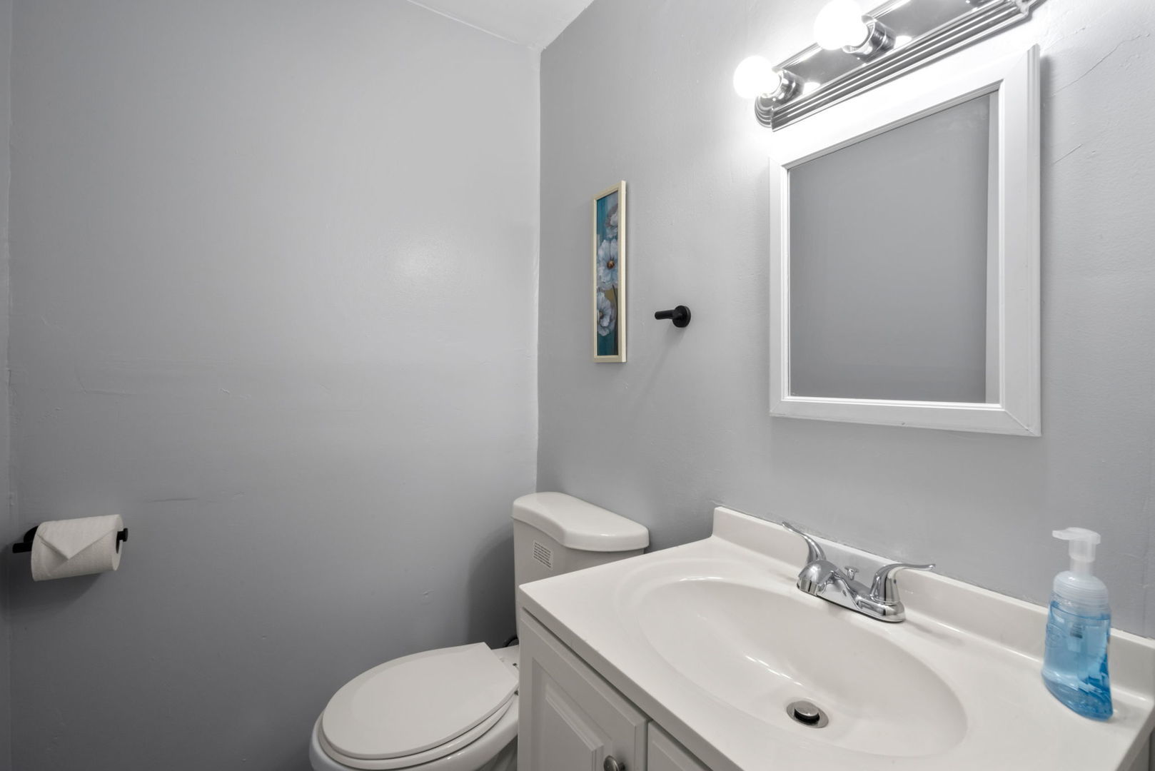 2102 West 73rd Street Chicago, IL 60636 - Photo 17 of 20 a bathroom with a sink a toilet and mirror