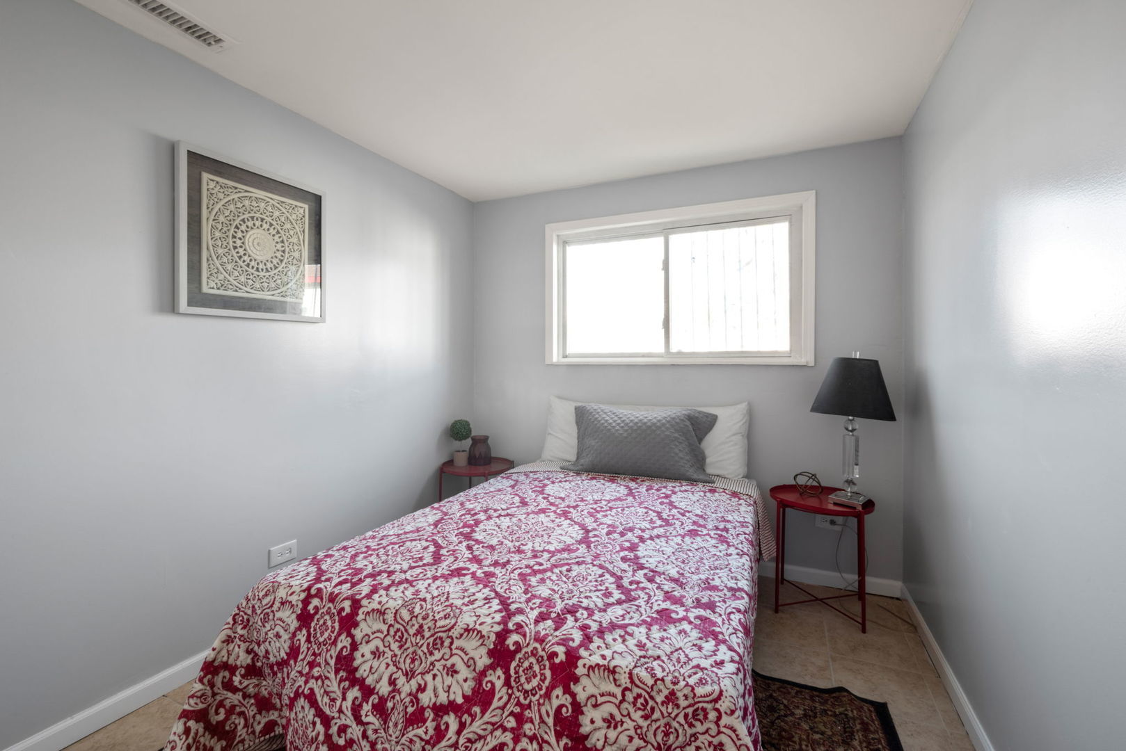 2102 West 73rd Street Chicago, IL 60636 - Photo 20 of 20 a bedroom with a bed and a window