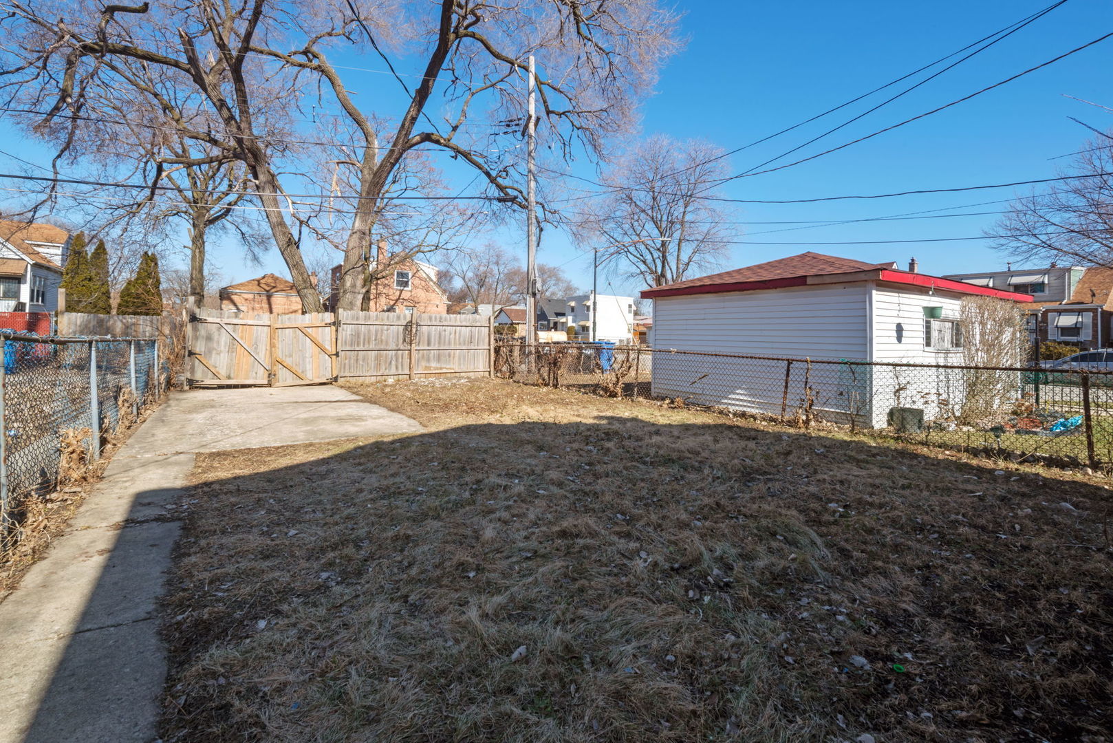 2102 West 73rd Street Chicago, IL 60636 - Photo 3 of 20 a view of a house with backyard and trees