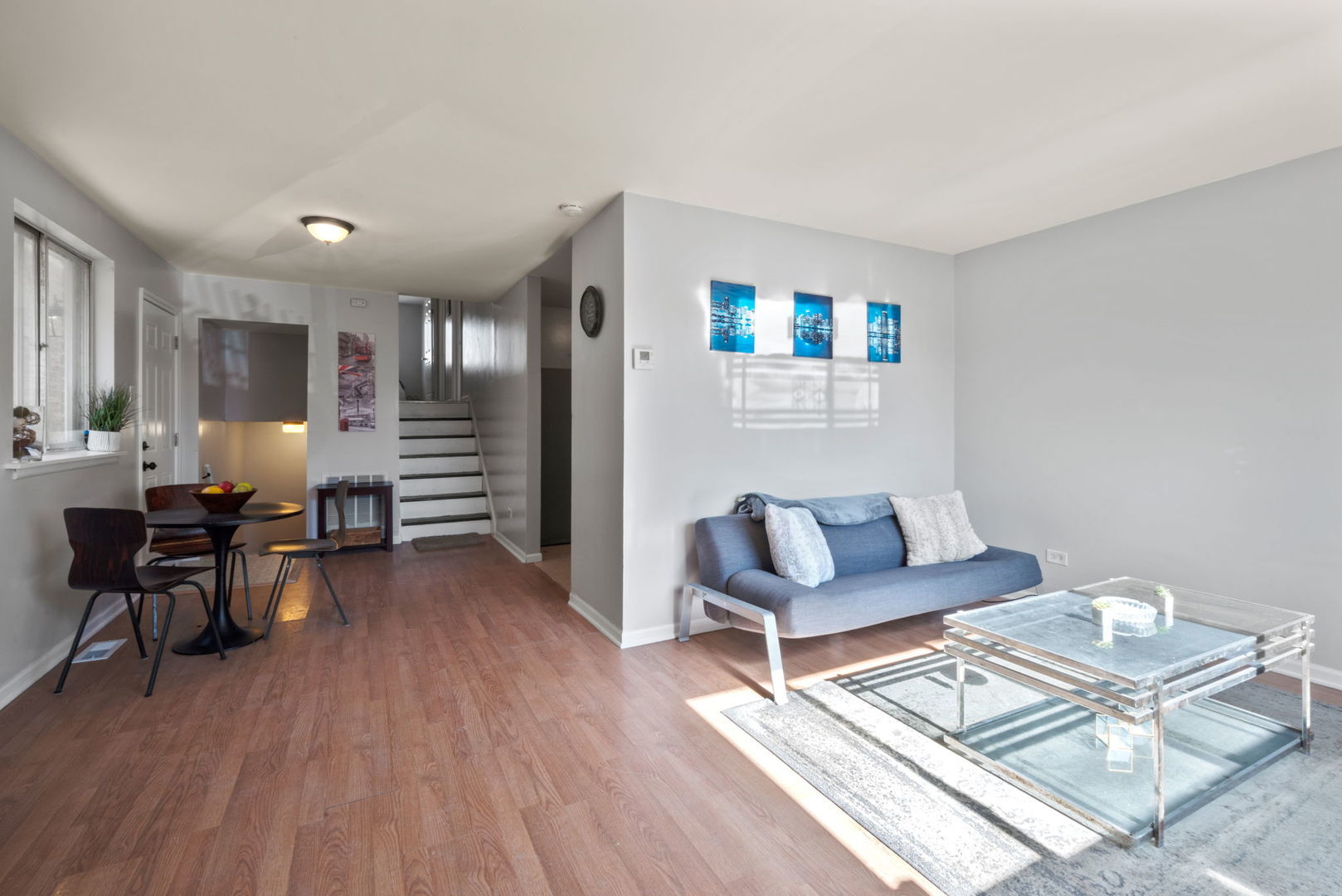 2102 West 73rd Street Chicago, IL 60636 - Photo 5 of 20 a living room with furniture and a wooden floor