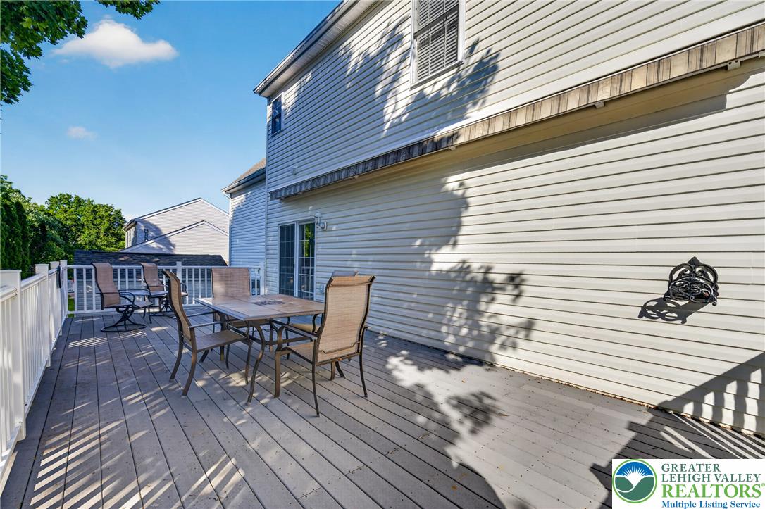 1702 Red Bud Road Quakertown, PA 18951 - Photo 62 of 68 An inviting deck extends from the home, perfect for outdoor dining and enjoying sunlit afternoons.