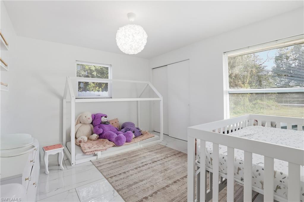 6005 Star Grass Lane Naples, FL 34116 - Photo 26 of 44 Bedroom with a closet