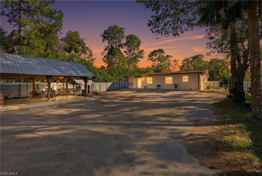 6005 Star Grass Lane Naples, FL 34116 - Photo 30 of 44 View of front of home with a metal roof