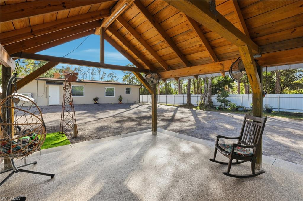6005 Star Grass Lane Naples, FL 34116 - Photo 34 of 44 Fenced backyard with a patio area