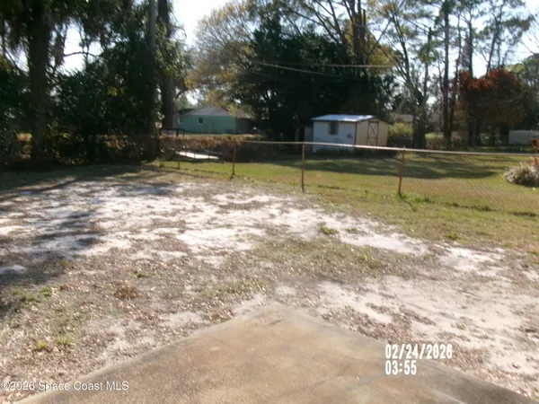 a view of a swimming pool with an outdoor space and seating area
