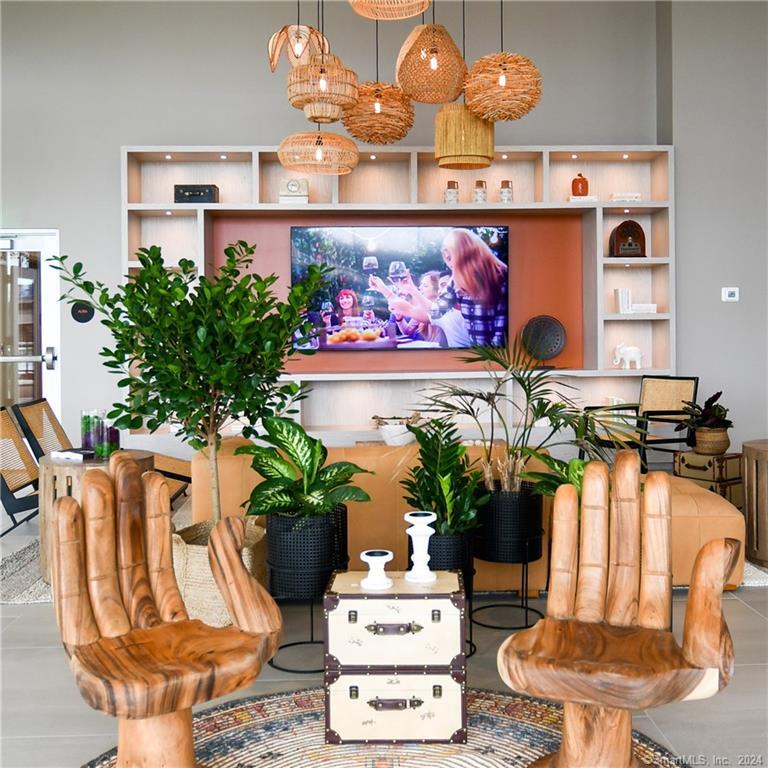2 Harbor Point Road South, Unit 502 Stamford, CT 06902 - Photo 2 of 13 a dining room with furniture and potted plant