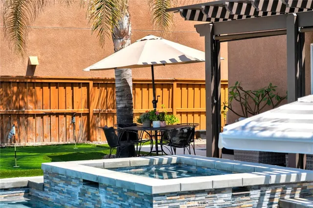 a balcony view with a couch and table chair