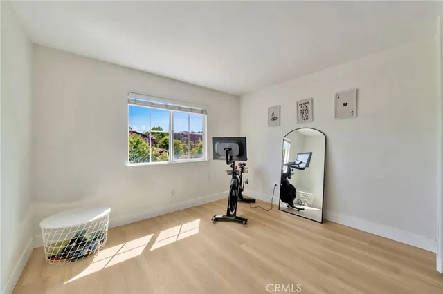 a bed room with a bed and a desk